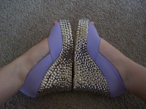 Shoes decorated with thumbtacks